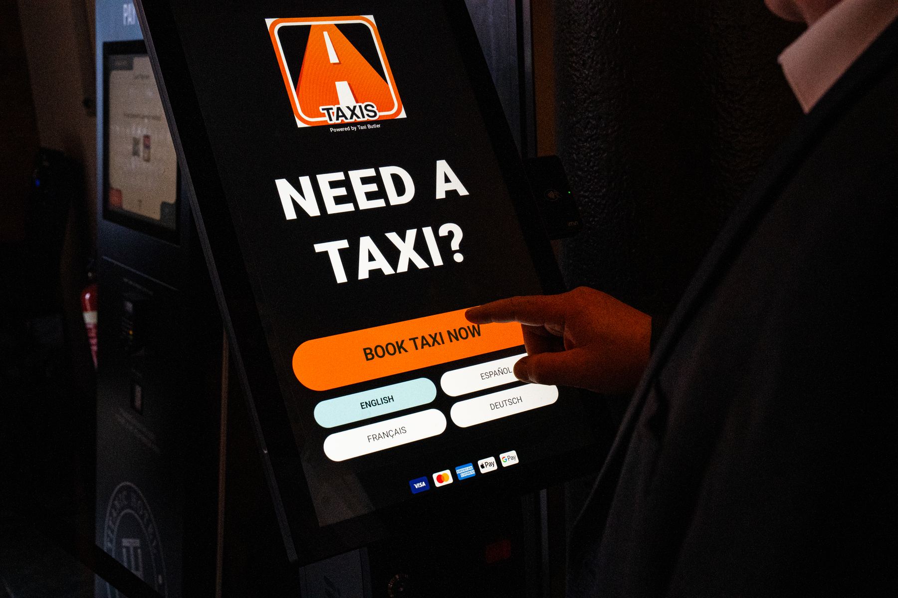Booking an Alpha taxi on a touchscreen booking kiosk